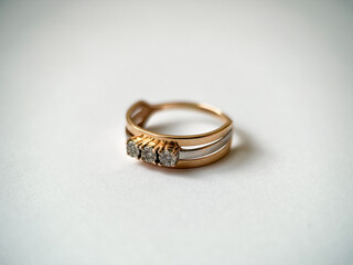 Gold diamond ring on a white isolated background. Red Gold Ring