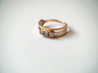 Gold diamond ring on a white isolated background. Red Gold Ring