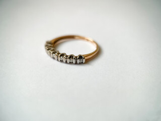 Gold diamond ring on a white isolated background. Red Gold Ring