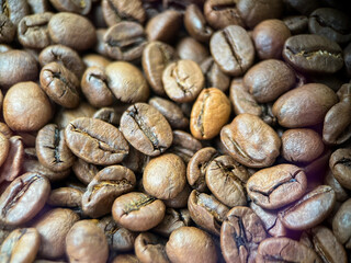 Coffee bean background close-up. Coffee beans in macro. Arabica coffee beans