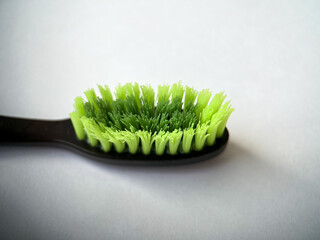 Green toothbrush bristles close up in macro