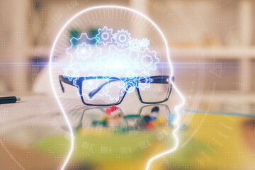 Brain drawings with glasses on the table background. Double exposure.