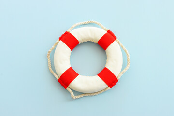 Top view image of lifebuoy over blue background - Powered by Adobe