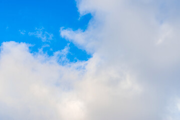 Nice cloudscape white fluffy clouds in the blue sky.Blue sky background with clouds