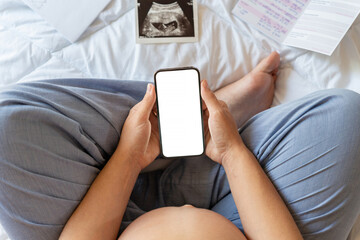 Pregnancy screen mockup. Mobile pregnancy online maternity application mock up. Pregnant mother using phone. Concept of pregnancy, maternity, expectation for baby birth.
