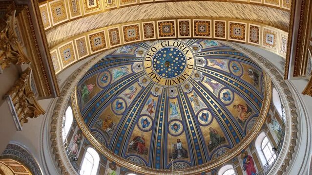 beautiful round ceiling with paintings in the catholic church
