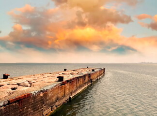  sunset on  pier on beach sea green water wave and blue  yellow cloudy sky nature seascape background 
