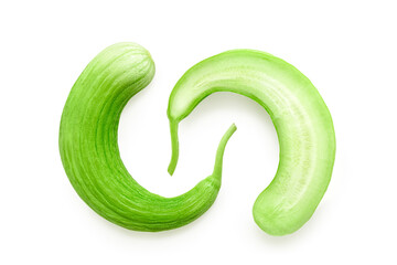 Sliced and halved Armenian cucumber or snake melon with fruit pulp, isolated with clipping path on...