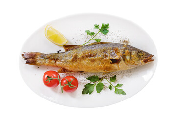 Plate of baked sea bass isolated on white background