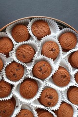 An overhead or flat lay view of Danish butter cookies in the traditional tin box. It's a Denmark delicacy consisting of butter, flour, and sugar. Danish chocolate chip biscuits. Copy space.