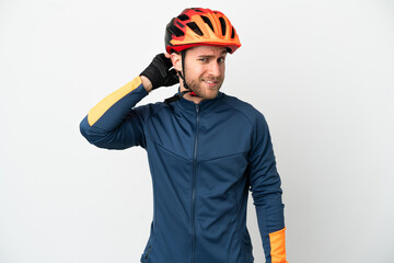 Young cyclist man isolated on white background having doubts
