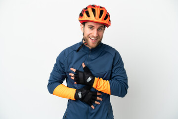 Young cyclist man isolated on white background smiling a lot
