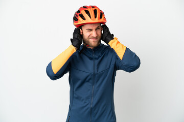 Young cyclist man isolated on white background frustrated and covering ears