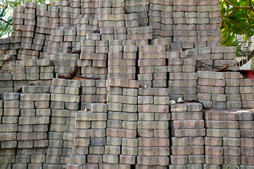 Close up of The grey bricks are laid out in a row for construction preparation in the building construction at Thailand.