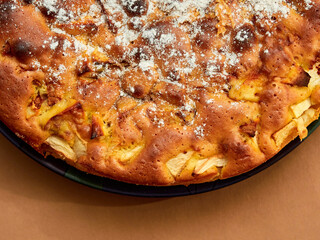 Homemade apple pie on a brown background