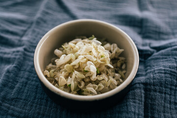 Sorted pea husks on the table in a bowl