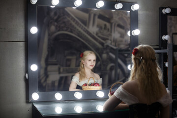 Beautiful woman actress or singer in retro dress in the dressing room before a mirror - obrazy, fototapety, plakaty