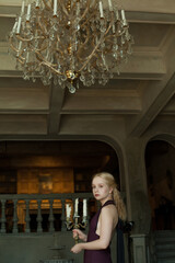 Retro styled portrait of young art woman in vintage home interior