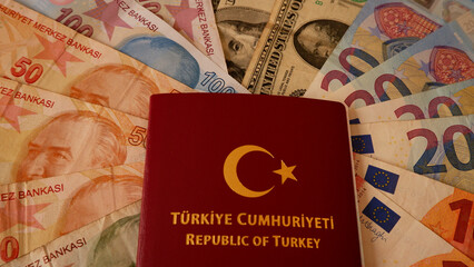 Turkish maroon passport on the money, euro, dollar and lira background.