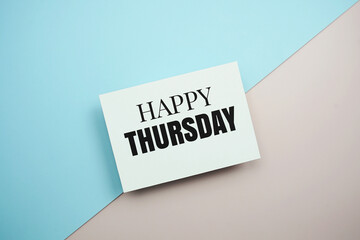 Happy Thursday text message on blue and pink background