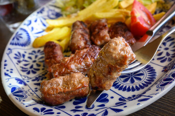 Cevapi also called Cevapсici - small sausages from chopped pork and beef with spices. Very popular dish in the Balkan countries