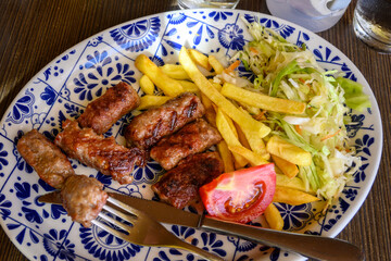 Cevapi also called Cevapсici - small sausages from chopped pork and beef with spices. Very popular dish in the Balkan countries