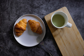 Homemade croissants on old table background.