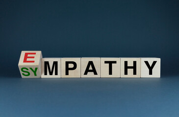 Obraz premium Sympathy or Empathy. Cubes form the words Sympathy or Empathy.