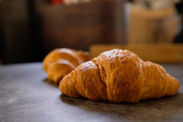 Homemade croissants on old table background.