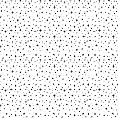 Seamless pattern of hand drawn stars of different sizes and shapes, black and white