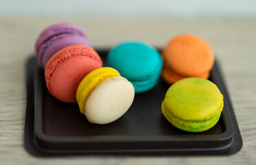 colorful macaroons on a wooden table