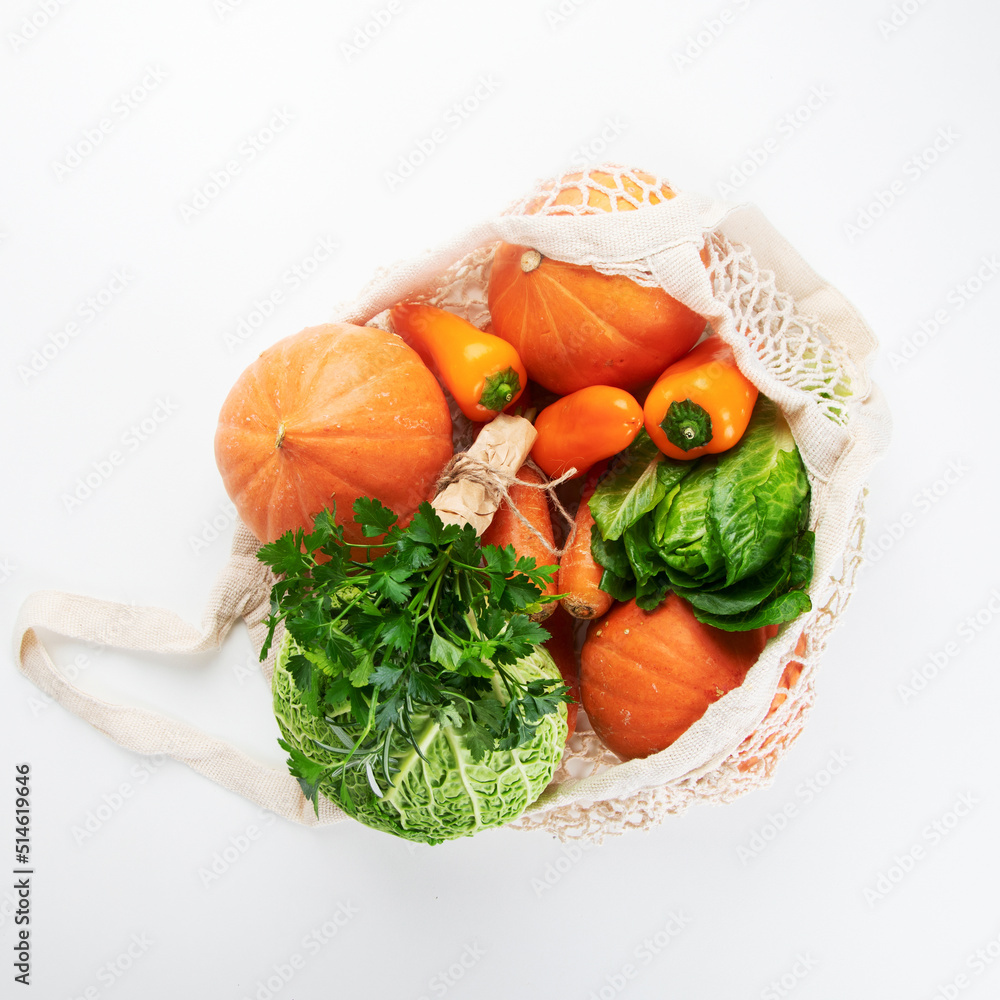 Wall mural Assortment of vegetables on light background.