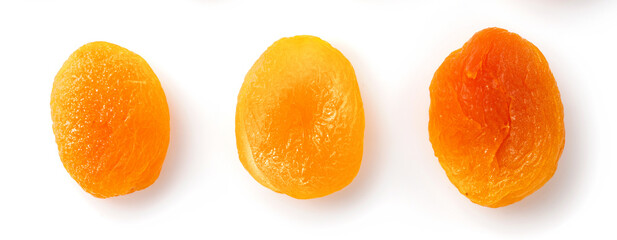 Three dried apricots isolated on white background. Top view of dried apricots.