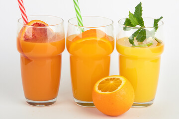 Fototapeta premium Fruit juices assortment on light background.