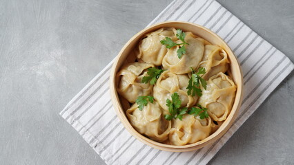 Manti, dumplings with minced meat wrapped in unleavened dough and cooked by steaming