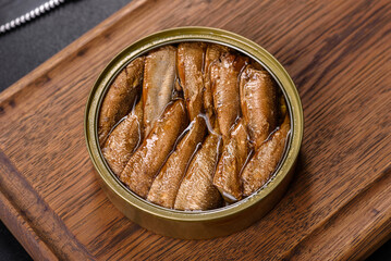 Delicious fresh sandwich with sprats with crispy toast, butter and cucumber