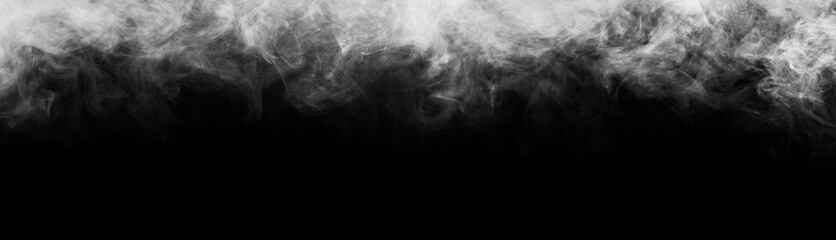 Abstract smoke texture frame over black background. Fog in the darkness. Natural pattern.