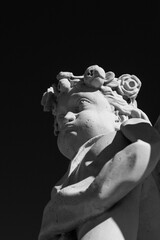 Black and white photo. white sculpture on a dark background. close-up.