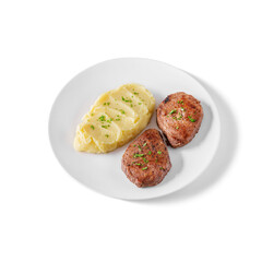 Boiled mashed potatoes with fried cutlets and parsley