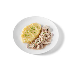 Boiled mashed potatoes with mushrooms in sauce and parsley
