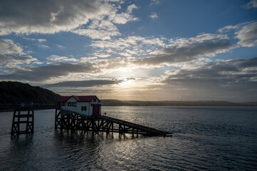Fototapeta na wymiar Mumbles Lighthouse and Pier, part of the Gower coastline in South Wales