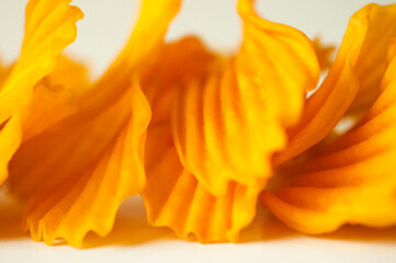 Fototapeta na wymiar close-up, golden yellow, sweet potato chips, white background