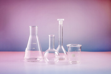 laboratory beakers on a gradient background