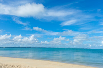 Fototapeta na wymiar Sea beach wave white sand against blue sky cloud serenity scene