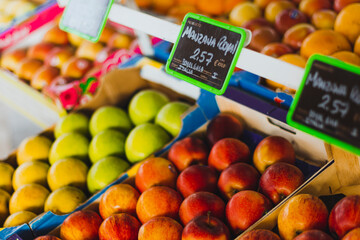 stand of green and red apples, in a spain market. Context