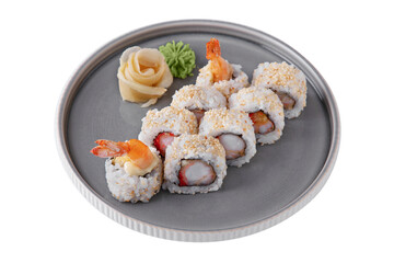 Rolls with sesame seeds, sauce, shrimps, cucumbers, rice, tobiko caviar