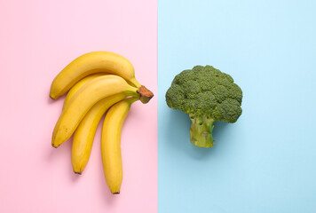 Healthy food concept. Broccoli with bananas on a blue-pink pastel background. Top view