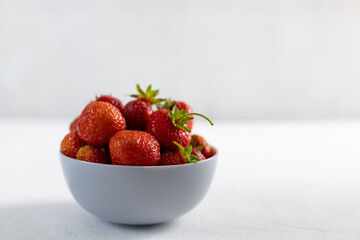 Ripe strawberries on light background, closeup