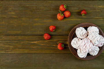 strawberry zephyr top view wooden background, copy space