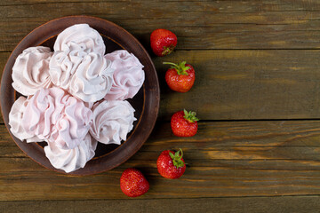 strawberry zephyr top view wooden background, copy space